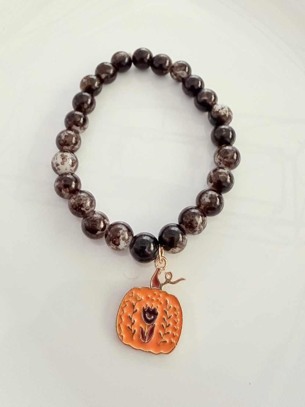 Brown Beaded Bracelet with Orange Pumpkin Charm